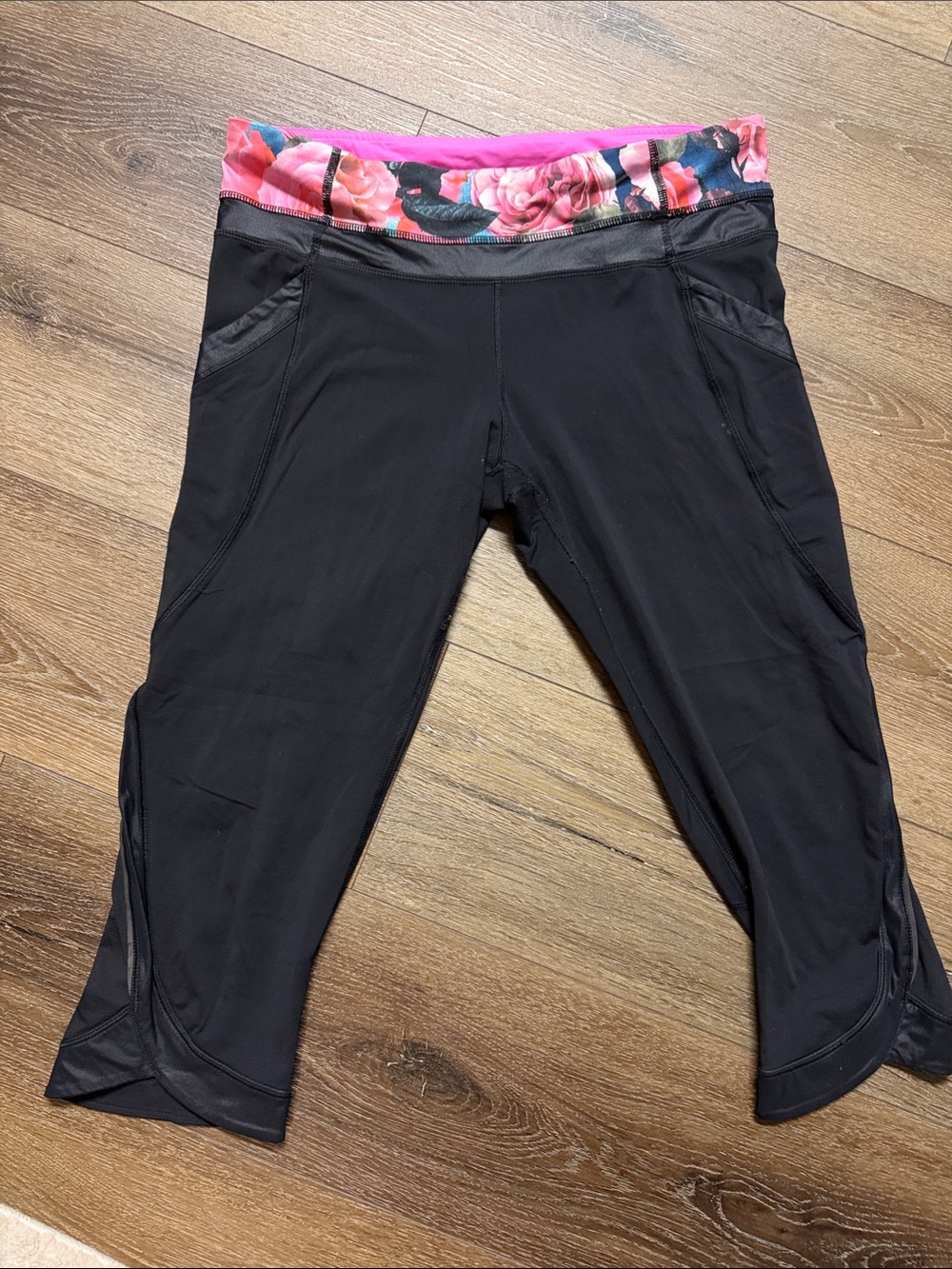 Lululemon Black Capris with Pink Floral Waistband, pockets and zipper pocket